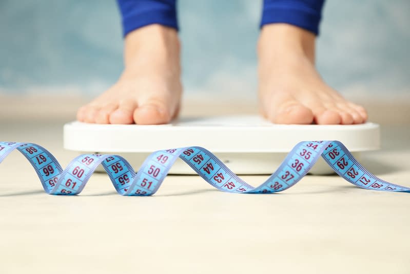 feet standing on scales